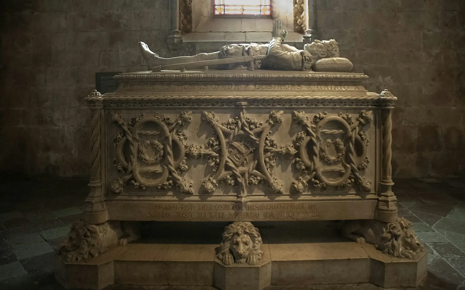 The carved stone tomb of the poet Luís de Camões inside the monastery church