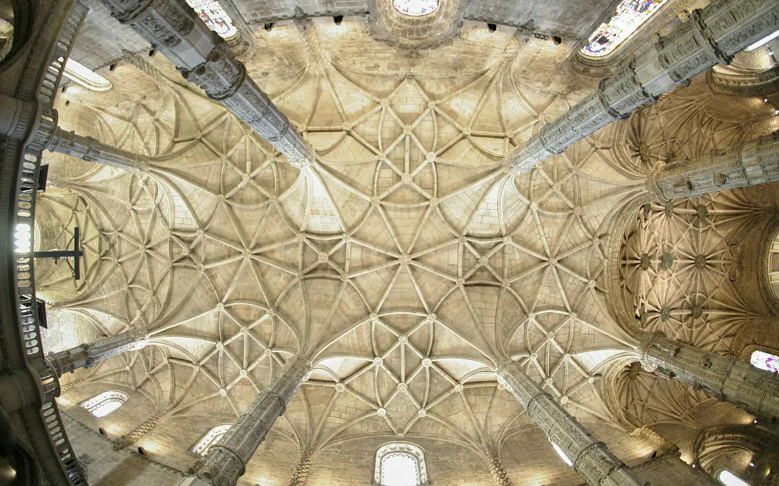 The ribbed star vault of the monastery church seen from below, the ribs spreading from slender columns